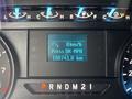 A digital dashboard display of a 2020 Ford F-150 showing speed in kilometers per hour and total distance driven of 108741.0 kilometers