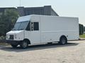 A 2018 Ford Econoline vehicle with a white exterior large cargo space and no visible branding or markings