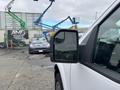 A 2020 Ford F-150 viewed from the side with a focus on the side mirror