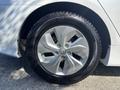 A close-up view of a silver alloy wheel on a 2015 Hyundai Sonata showing five spokes and a Michelin tire with visible tread patterns.