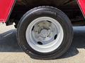 A silver alloy wheel with a black tire labeled Continental 225/70 R 19.5 mounted on a 2007 GMC C4500 TopKick