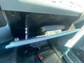 The image shows the interior of a 2016 Ford F-350 SD with an open glove compartment containing a small black object and some wires visible inside