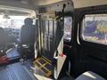 A foldable wheelchair lift is installed inside a 2020 RAM ProMaster 3500 providing accessibility for individuals with mobility challenges