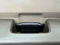 Close-up of a gray plastic interior handle in a 2008 Ford F-250 SD's door panel