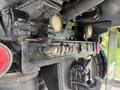 Close-up of a 2013 Freightliner 114SD chassis featuring a detailed view of the rear axle components and a trailer hitch assembly