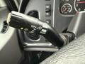 Close-up of a Freightliner 108SD turn signal lever featuring controls for off and flash functions