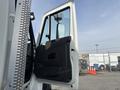 A 2013 International WorkStar truck with its driver's side door open displaying the interior door panel and mirror