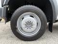 Close-up of a silver aluminum wheel with a Michelin tire mounted on a 2008 Ford F-450 SD