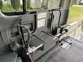 A 2009 Toyota Hiace interior featuring a gray seat frame and storage structure with a flat surface and attached handles