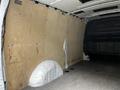 Interior view of a 2020 Mercedes-Benz Metris van showing a wooden panel covering the walls and a flat floor without any cargo or equipment visible