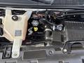 The image shows the engine compartment of a 2018 Chevrolet Express featuring the engine intake manifold coolant reservoir and various engine components