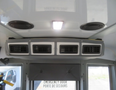 The interior view of a 2020 Chevrolet Express showing the overhead ventilation system with air vents and speakers