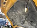 The underside of the hood of a 2017 Ford F-250 SD showing the Ford logo and a small light attached