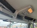 Interior view of a 2012 International 7300 Workstar showing overhead control panel with lights and vents