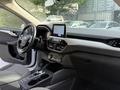 Interior of a 2020 Ford Escape featuring a modern dashboard with a central touchscreen display and a stylish console with controls and gear shifter