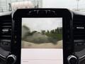 A 2024 RAM 5500 displayed on a touchscreen interface showing a camera view of an outdoor scene with blurred details of vehicles and surroundings