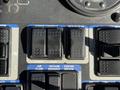 Control panel with buttons labeled Hopper Controls, Door, Pickup Head, Air Flow, Vacuum Enhance, and Center Broom in blue and black colors