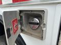 Close-up of the gas fuel cap on a 1994 GMC Vandura 3500 with a warning label indicating gas only