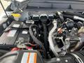 2014 Ford F-250 SD engine compartment with visible components including battery pipes and wiring