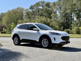 A white 2020 Ford Escape parked with a sleek design and modern features visible including alloy wheels and a distinctive front grille