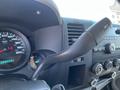 Close-up view of the dashboard of a 2013 Chevrolet Silverado 1500 showing the speedometer and gear shift lever