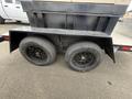 2005 Katolight SED60FPJ4 generator on a trailer with two black wheels and tires visible in the foreground