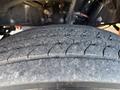 Close-up view of a tire from a 2022 Lion Lion6 showing detailed tread patterns and wear on the rubber surface