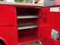 Red storage compartment with three metal shelves inside designed for a 2015 Chevrolet Silverado 3500HD