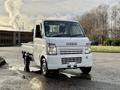 A white 2008 Suzuki Carry mini truck with a flatbed and a simple design is parked on a roadway with a clean front view