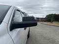 A 2016 RAM 1500 pickup truck with a focus on the side mirror in the foreground