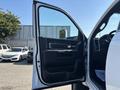 A 2018 RAM 3500 with an open door showcasing the interior features and door panel design