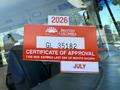 A red and white vehicle sticker from British Columbia displaying a certificate of approval with the year 2026 and license number GL 35182