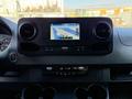 Interior dashboard of a 2020 Mercedes-Benz Sprinter featuring a touchscreen navigation display and climate control buttons