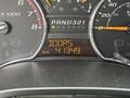 The dashboard of a 2011 Chevrolet Colorado displaying the odometer reading of 41349 kilometers and the transmission indicator in park position