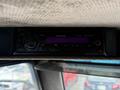 A Kenwood car stereo system model KDC-MP145 mounted in a vehicle's interior