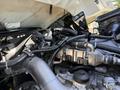 Close-up of a 2009 International 3000 CE engine showing various components including pipes connectors and wiring