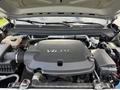 Engine compartment of a 2018 Chevrolet Colorado showcasing the V6 engine and various components such as hoses and connectors