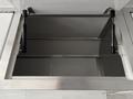 An open access hatch with stainless steel hinges and support struts for a 2020 Freightliner MT45