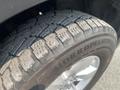 Close-up of a tire on a 2015 RAM 1500 showing tread pattern and brand name Hakkapeliitta