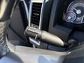 A close-up of the windshield wiper control stalk from a 2018 RAM 3500 featuring buttons for mist and various wiper speeds