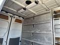 Interior of a 2010 Mercedes-Benz Sprinter van featuring metal shelving and storage compartments