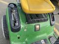 2021 John Deere L Series S riding mower showing the seat throttle control and steering wheel with various speed and function settings