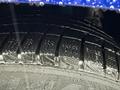 Close-up of a wet tire tread of a 2020 Dodge Grand Caravan showing detailed grooves and patterns designed for traction