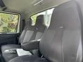 Interior of a 2012 International 7300 Workstar featuring two driver and passenger seats with fabric upholstery and armrests
