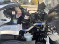Engine compartment of a 2022 Freightliner M2 106 showing various components including the engine, coolant tank and hoses