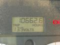 Dashboard display of a 2010 Freightliner M2 106 showing trip mileage of 10662.6 hours and voltage reading of 13.9 volts