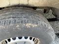 A close-up of a rugged tire from a 2016 Mercedes-Benz Sprinter showing noticeable wear and dirt on the tread and rim