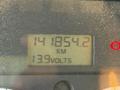 A digital display showing a mileage reading of 141854.2 km and a voltage reading of 13.9 volts