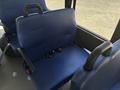 A blue seat with a backrest and seatbelt designed for a 2020 Chevrolet Express