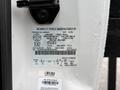 A 2008 Ford F-350 with a vehicle identification label displaying specifications and manufacturing details